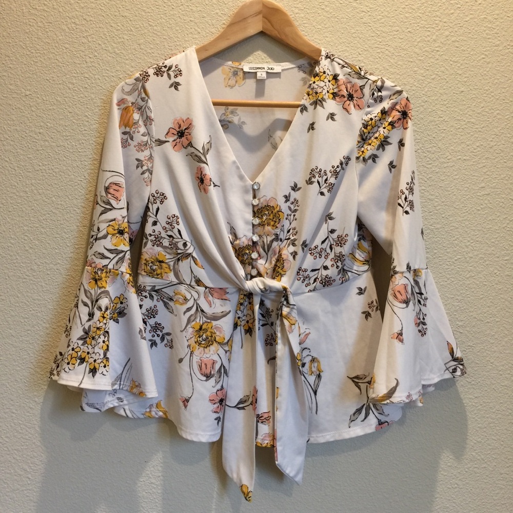 Peplum bell sleeve floral blouse with tie front